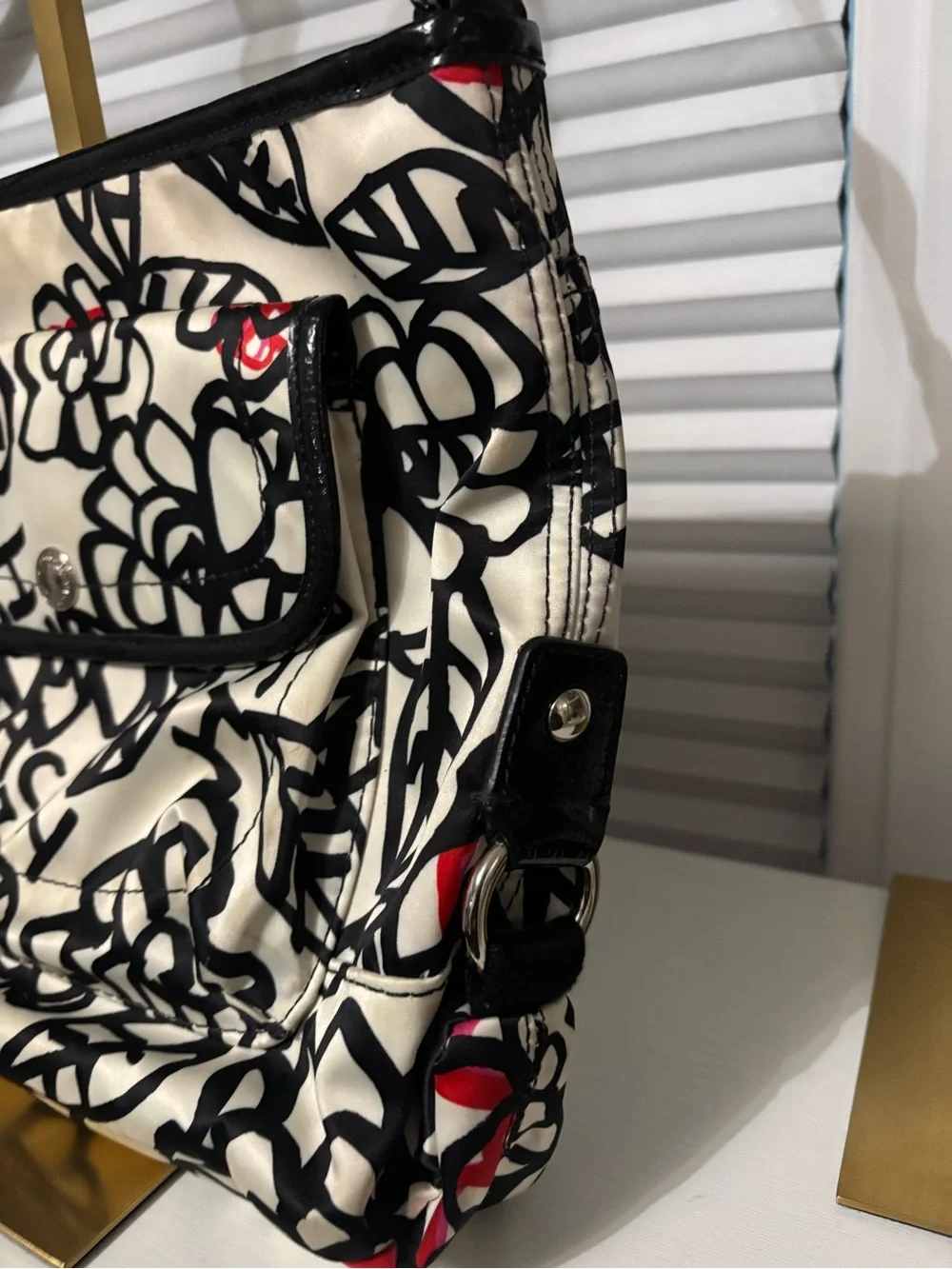 Coach Cream Canvas Crossbody with Black Floral Outline and Red Accents